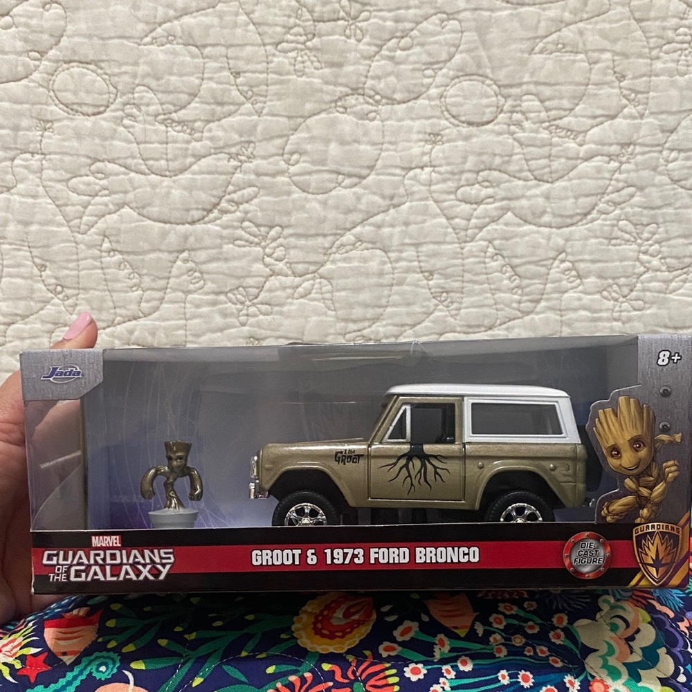 Ada Gold and White Toy Car with Groot Figure